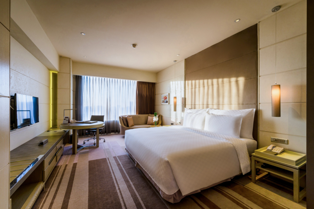 Guestroom welcoming natural light at a beautiful boutique saigon hotel